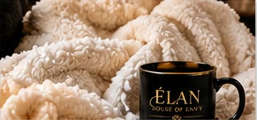 Cream throw and black coffee mug